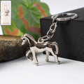 Premium metallic horse keychain with polished chrome finish on white background
