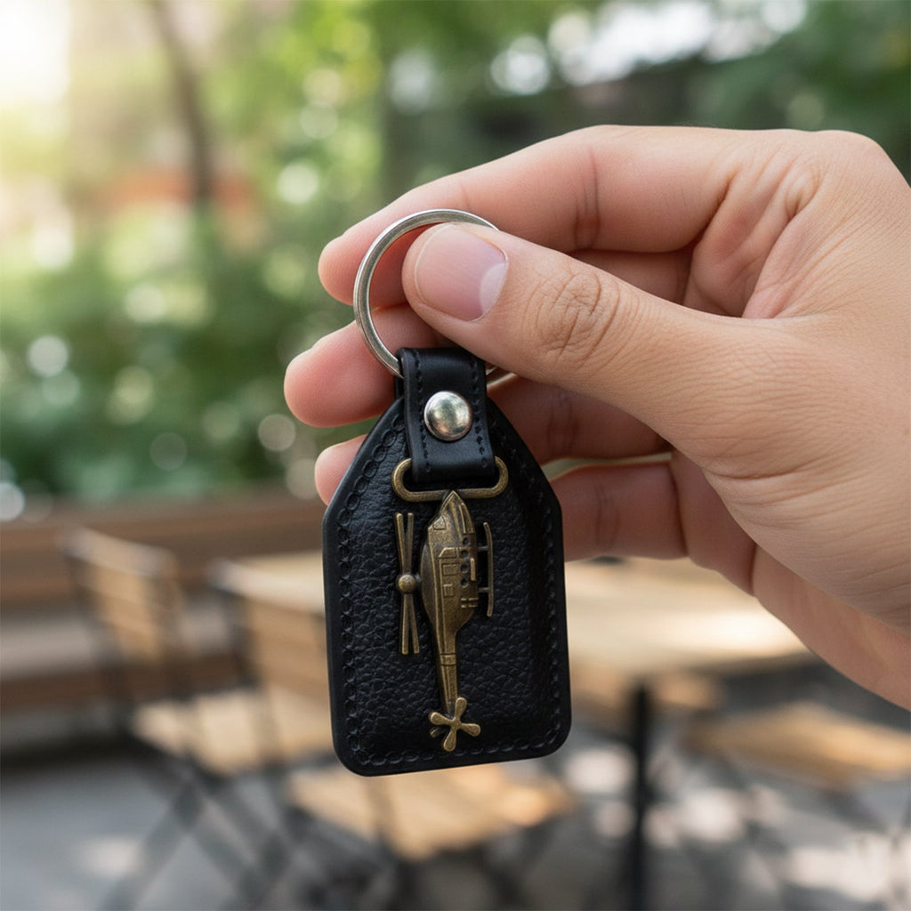 Back view of leather and metal sword emblem keychain