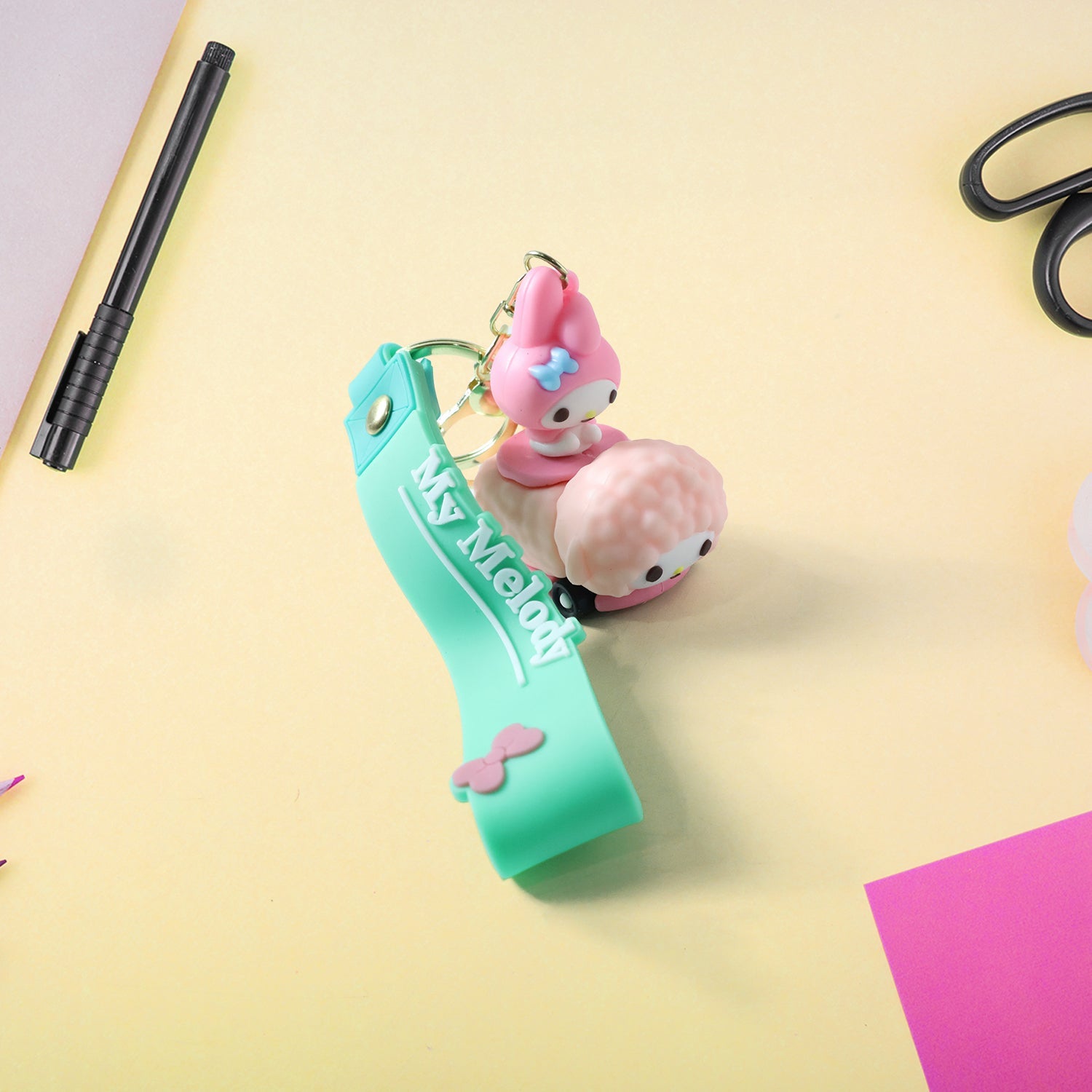 Various angles of colorful silicone cartoon character keychain