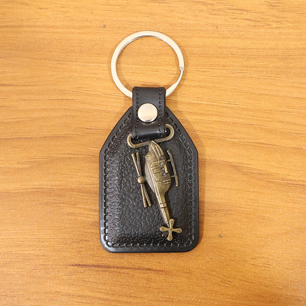 Full display of stylish leather and metal sword emblem keychain