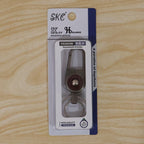 Compact metal key holder featuring locking carabiner clip in outdoor setting
