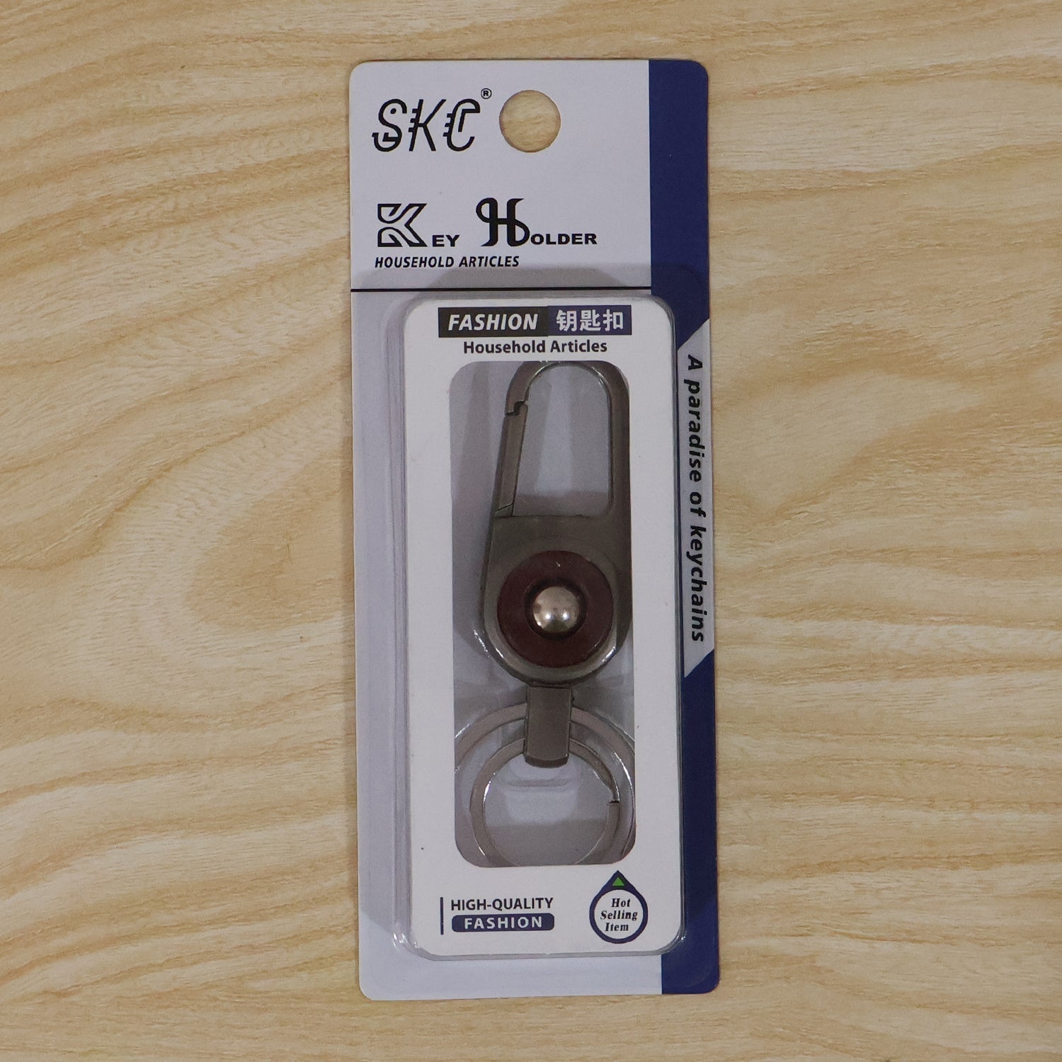 Compact metal key holder featuring locking carabiner clip in outdoor setting
