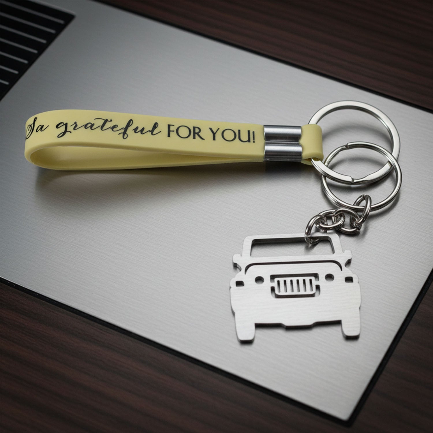 Dual keyrings and grip strap on metal car keychain with jeep charm