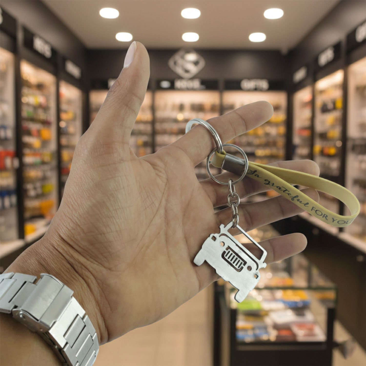 Stylish metal car keychain set showing various angles with jeep charm