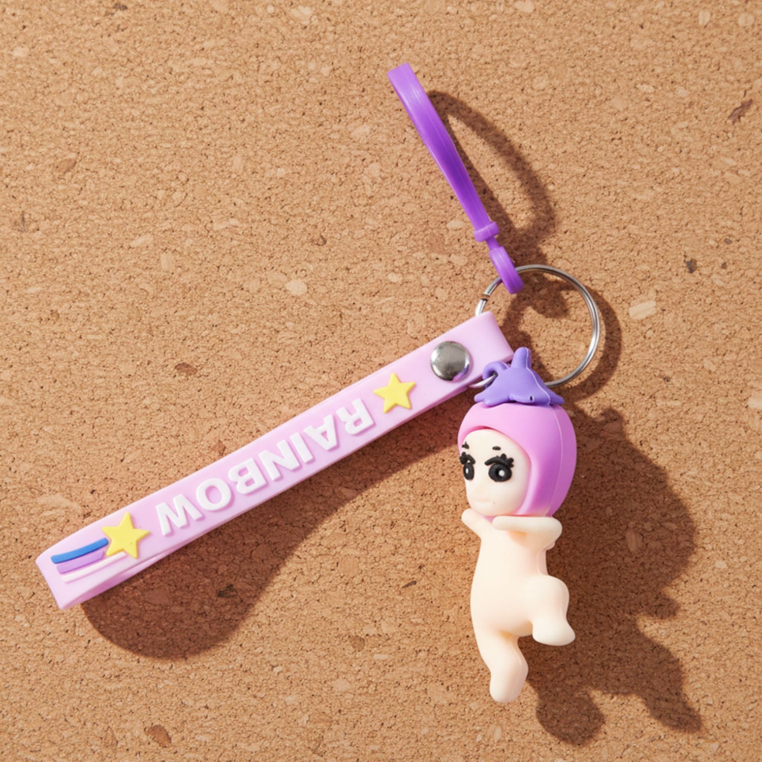 Detailed shot of baby doll keychain showing silicone texture