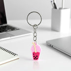 Bubble tea keychain displayed on a backpack zipper pull