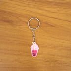 Lifestyle image showing bubble tea keychain as a trendy bag charm