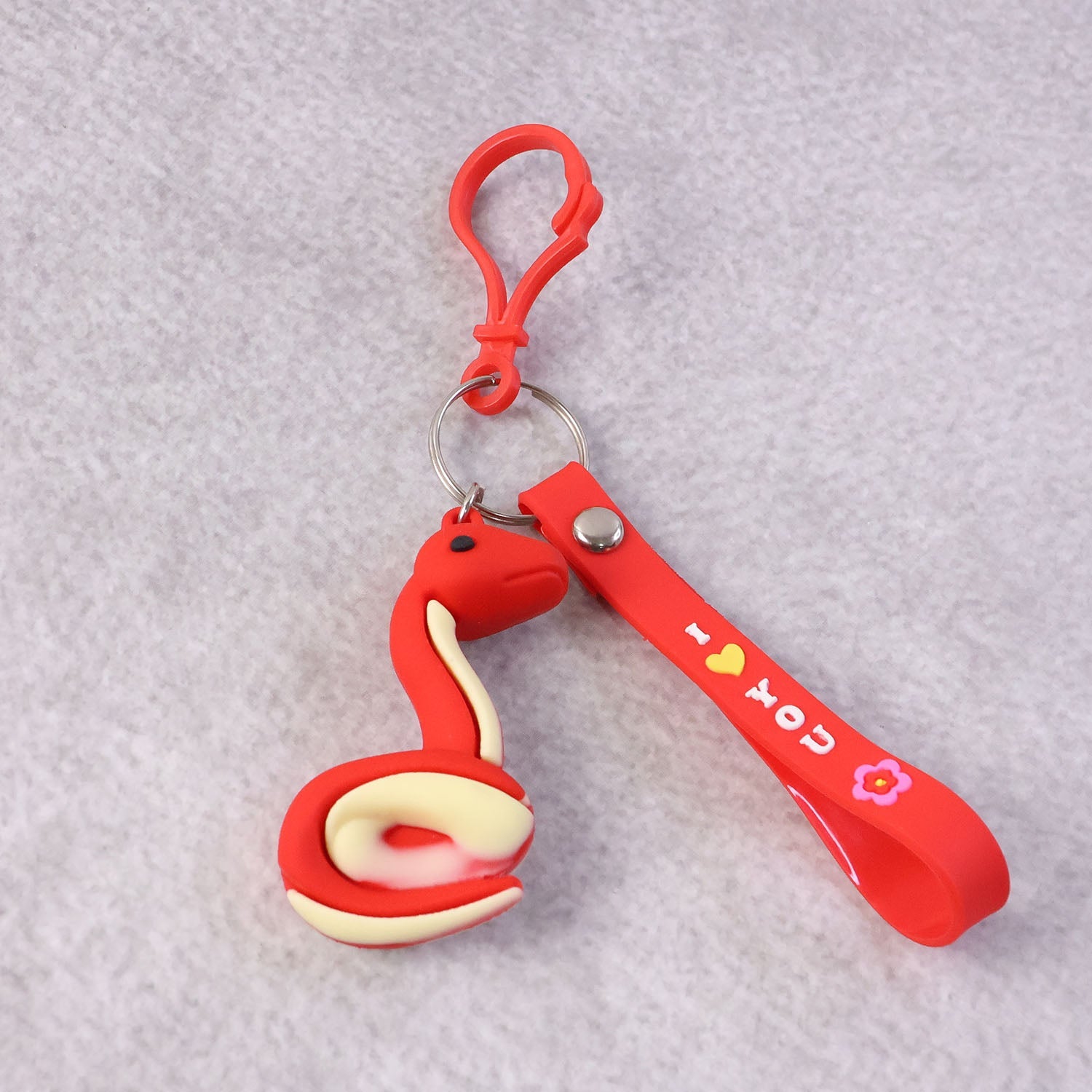 Side view of the cartoon snake keychain highlighting its compact design