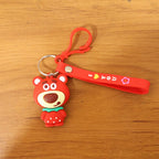Lifestyle image of cartoon bear figure keychain hanging on backpack