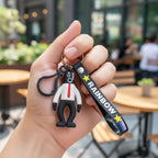 Keychain showing cartoon man figure and detailed rainbow strap