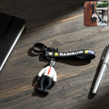 Cartoon man keychain with vibrant rainbow strap attached to keys