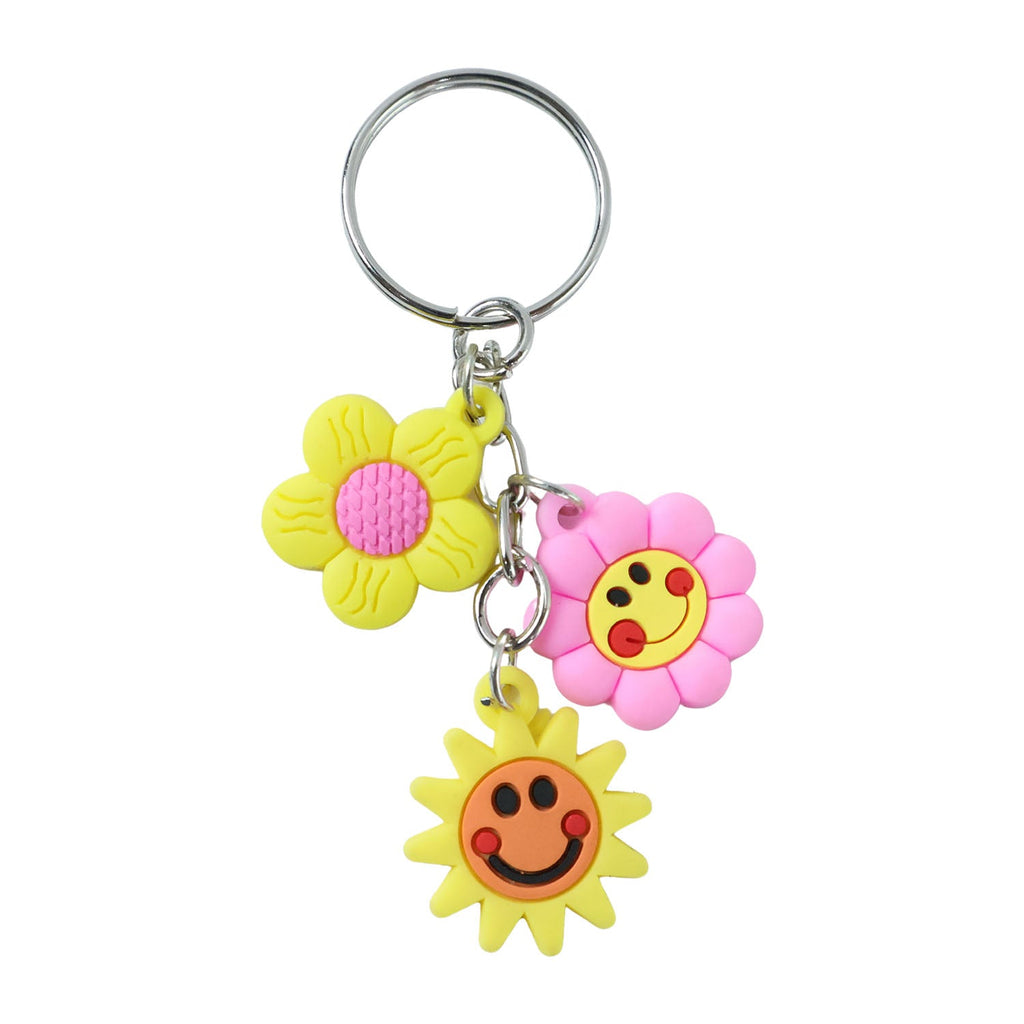 Key holder with flower and smiley face charms attached to keys