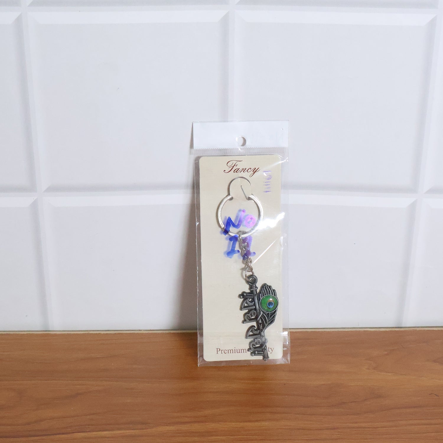 Lifestyle image showing Radha Krishna Radhe Radhe keychain in use