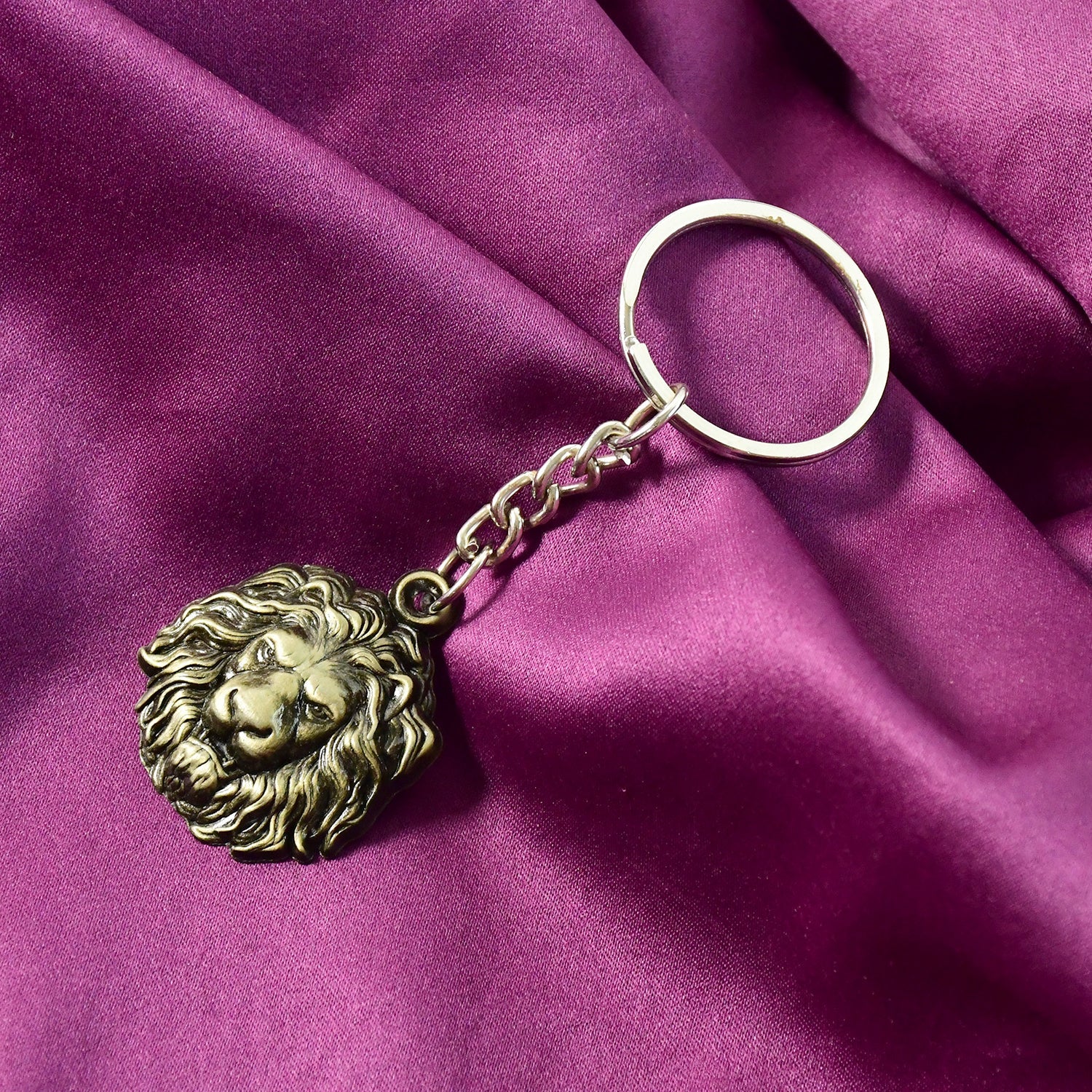 Side angle of metal lion head keychain emphasizing quality and design