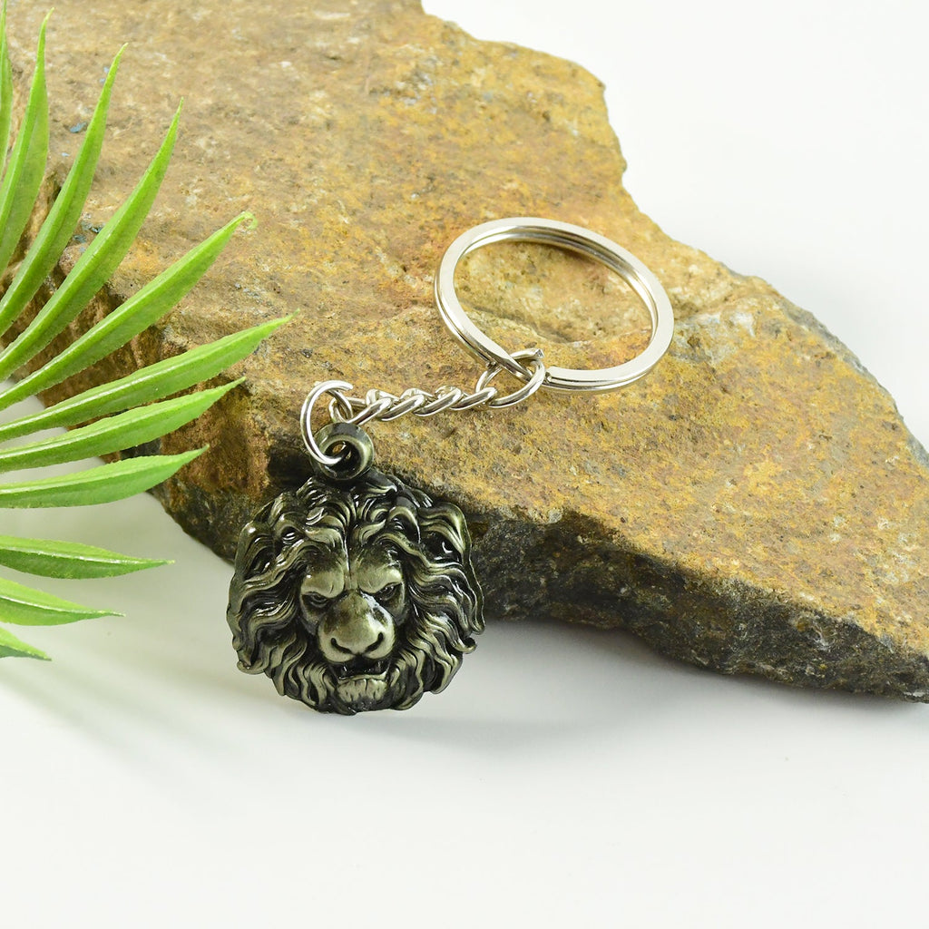 Close-up detail of lion head on metal keychain showing fine craftsmanship