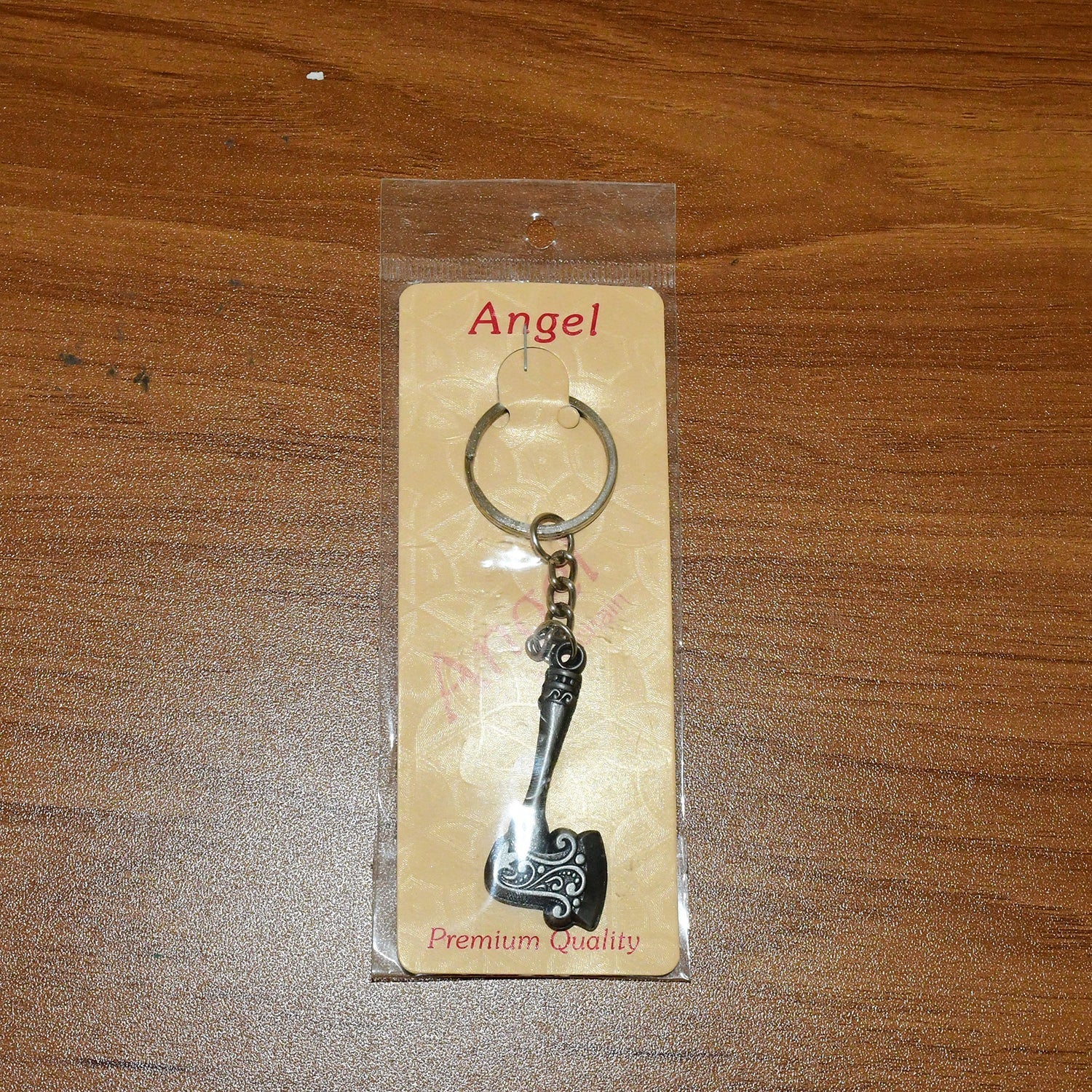 Keychain featuring an axe shape with robust metal construction