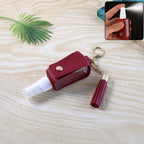 Faux leather hand sanitizer holder keychain featuring elegant tassel