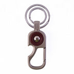 Modern design metal key holder that clips easily onto belts and bags.
