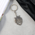 Crowned lion head keychain held in hand showing size and elegant design
