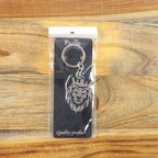 Back view of durable metal lion head keychain with crown design