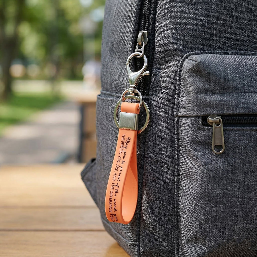 Wrist loop key holder with metal attachment