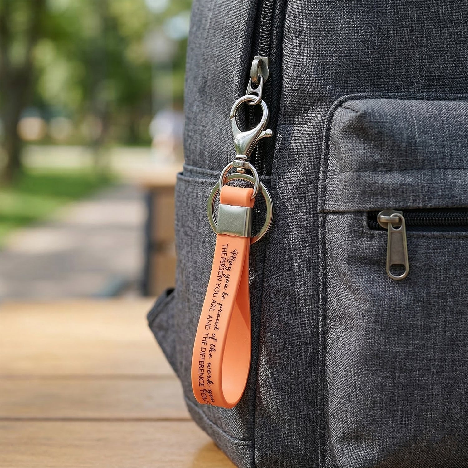 Wrist loop key holder with metal attachment