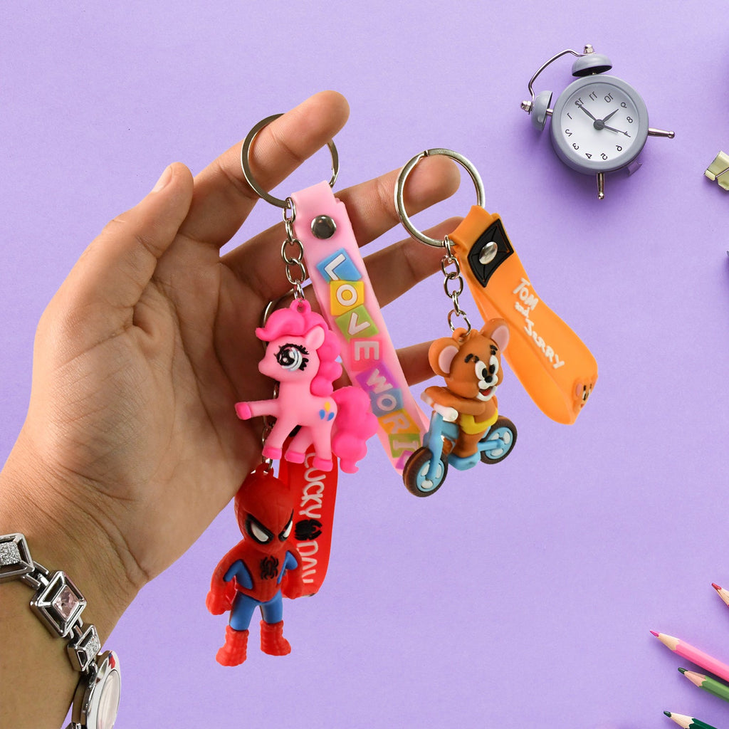 Assortment of colorful cartoon silicone keychains, showcasing different character styles.