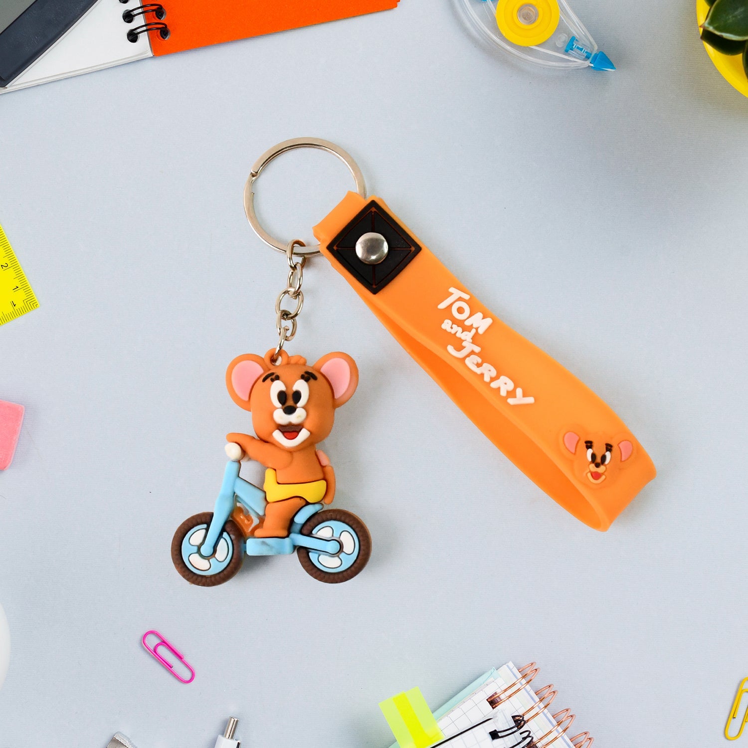 Collection of vibrant cartoon silicone keychains in various 3D character designs.