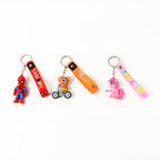 Detailed view of the metal hook and silicone strap on a cartoon silicone keychain.