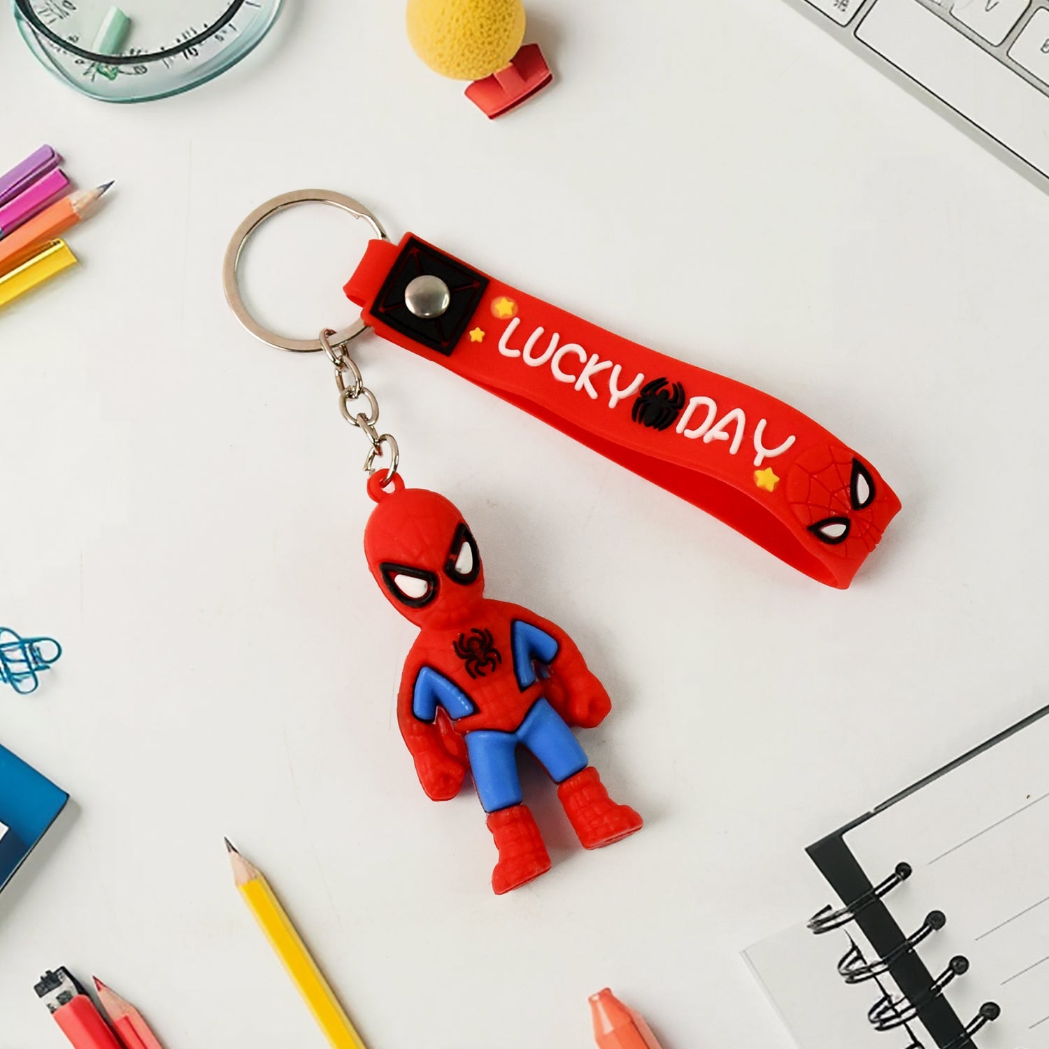 Cartoon silicone keychain attached to a bag, demonstrating its use as a stylish accessory.