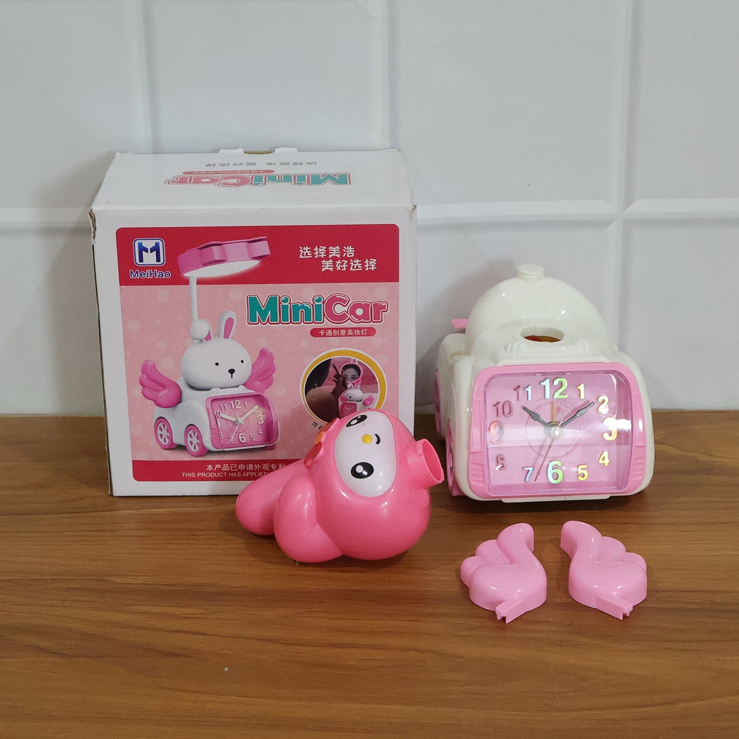 Decorative pink cartoon bunny alarm clock for children’s room