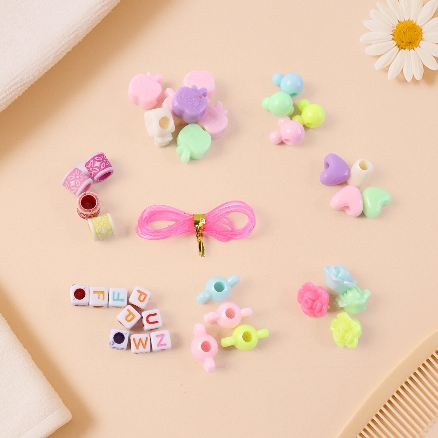 Organized tray holding beads and charms in beading jewellery kit for kids