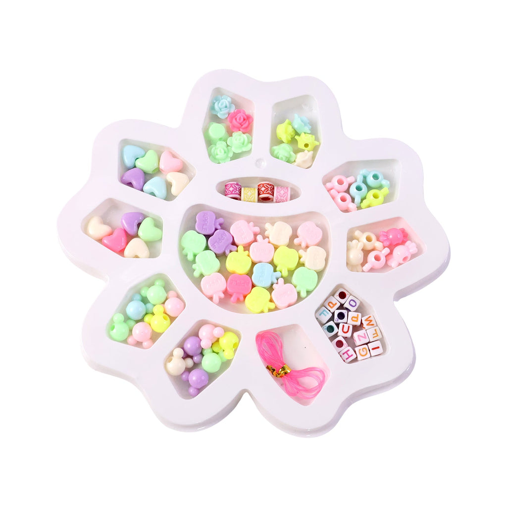 Kids crafting colourful bracelet using DIY beading jewellery kit