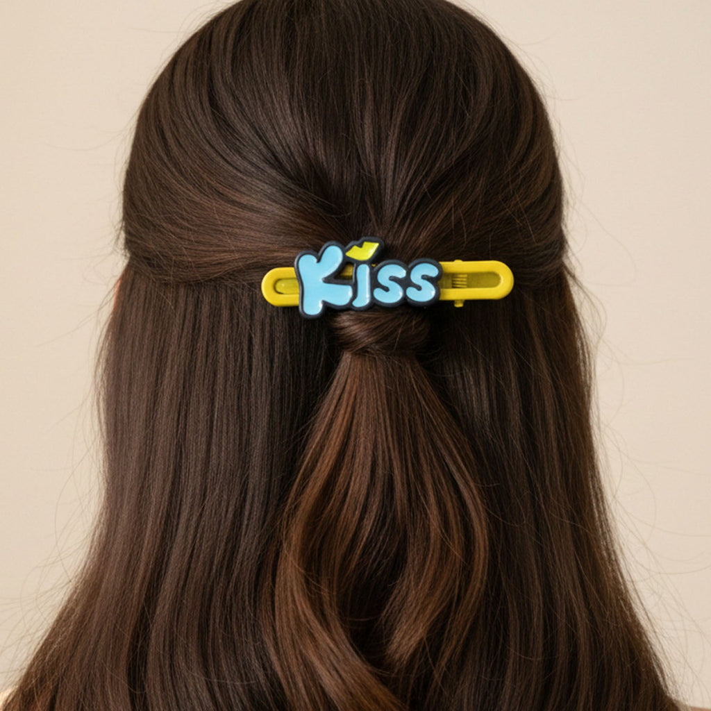 Lifestyle image of Kiss text hair clips styled in hair