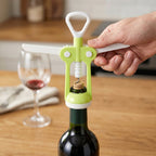 Ergonomic wine bottle opener from the Quickslice Kitchen Tool Set, effortlessly uncorking a bottle.
