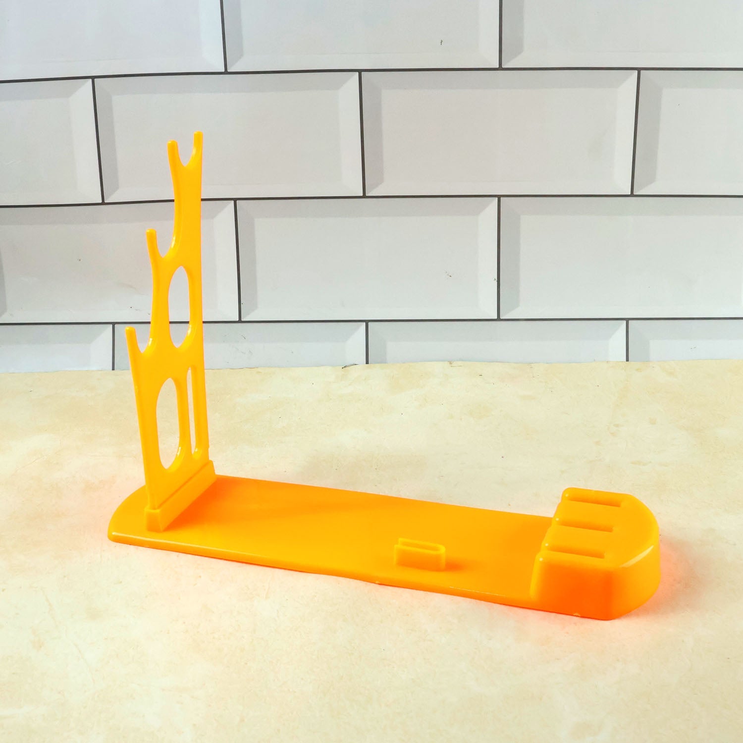 Top-down view of the plastic kitchen knife stand, highlighting the multiple slots for different knives.