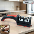 Red and black 3-stage manual knife sharpener for home kitchen use.