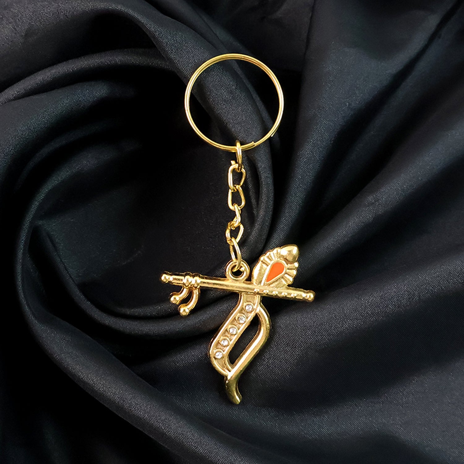 Backside view of Krishna metal keychain revealing smooth metallic finish