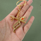 Front view of metal Krishna keychain with intricate peacock feather and flute