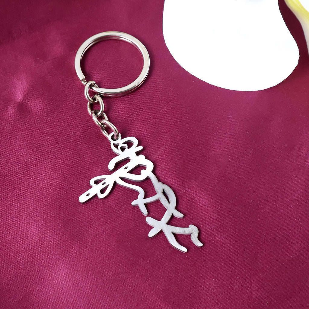 Elegant metal Krishna keychain with polished finish