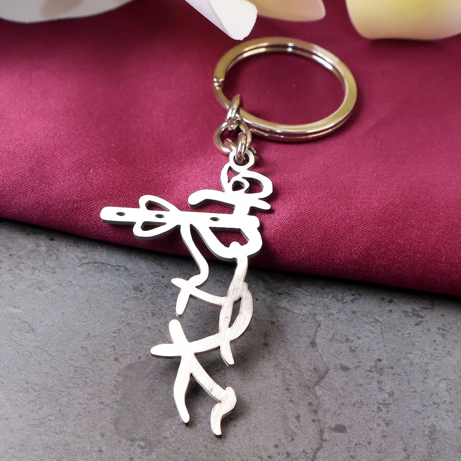 Krishna flute design stainless steel keychain with spiritual motif