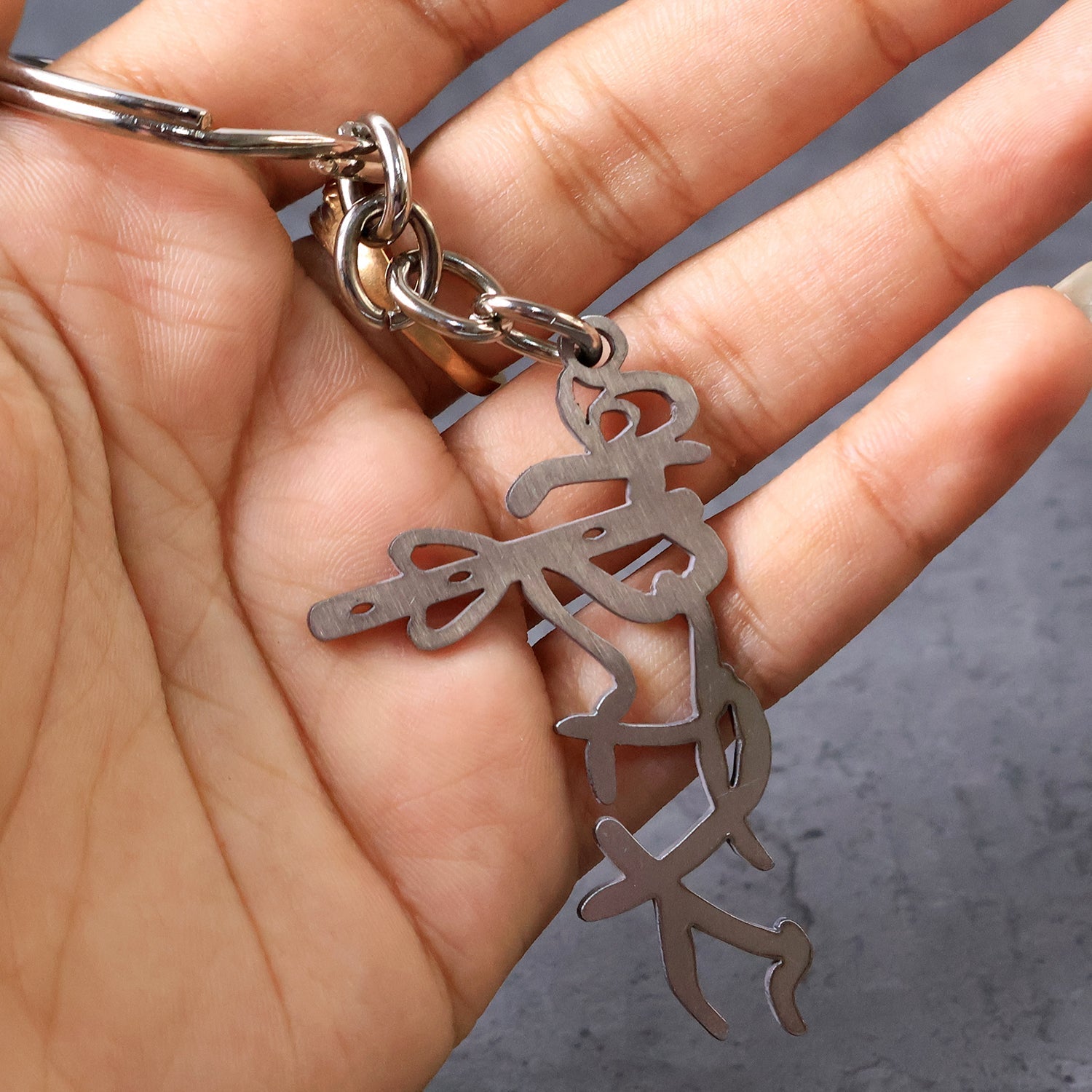 Auspicious Krishna flute style metal key holder accessory