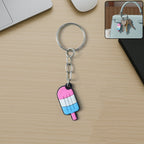 Colorful ice cream popsicle keychain with metal ring hanging on backpack zipper