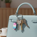 Close-up of popsicle-shaped colorful cartoon key holder with metal ring