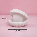 Front view of the glowing Pearl Shell Night Lamp, perfect for bedroom mood lighting.
