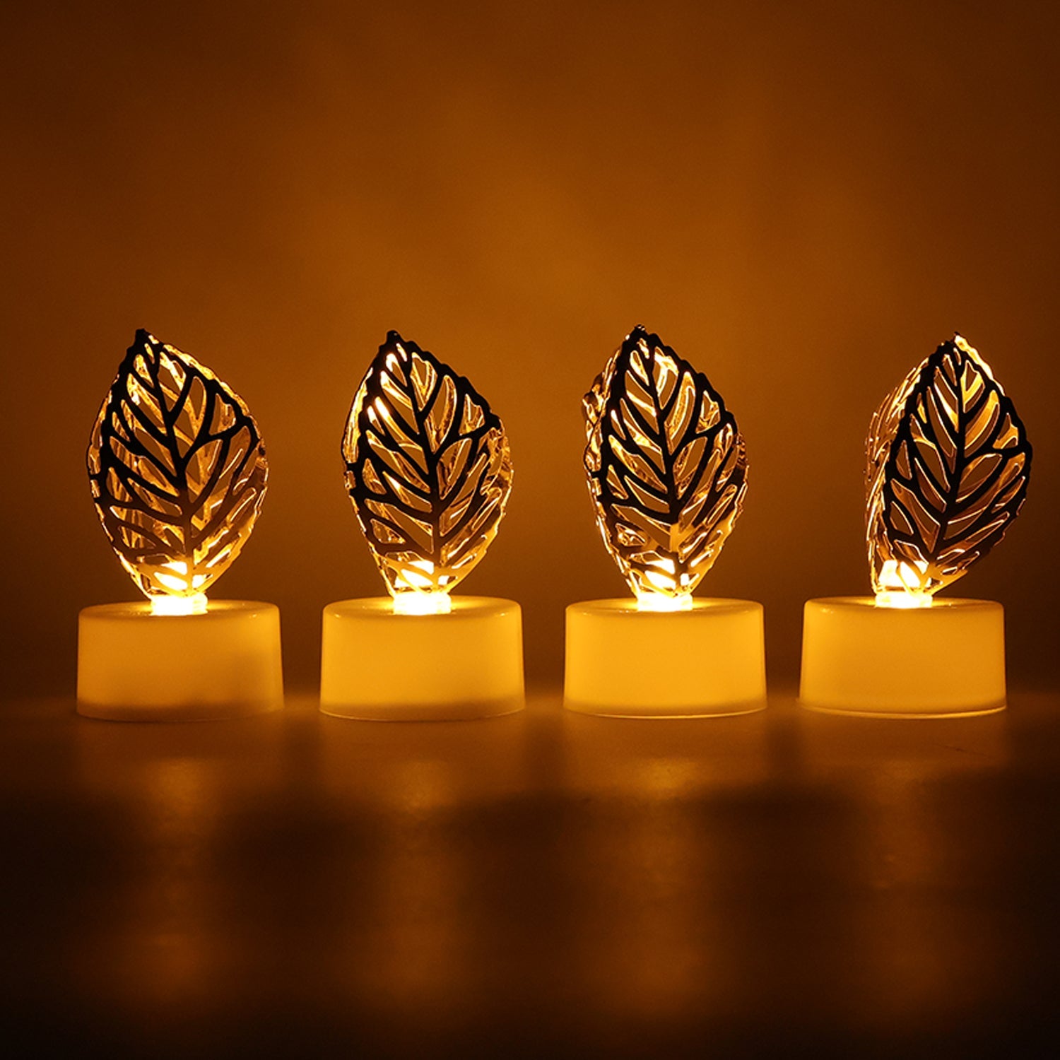 Side view of a golden leaf LED candle, demonstrating its battery compartment and on/off switch.