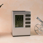 Modern cube digital desk clock with pen holder on white background showing clear digital time