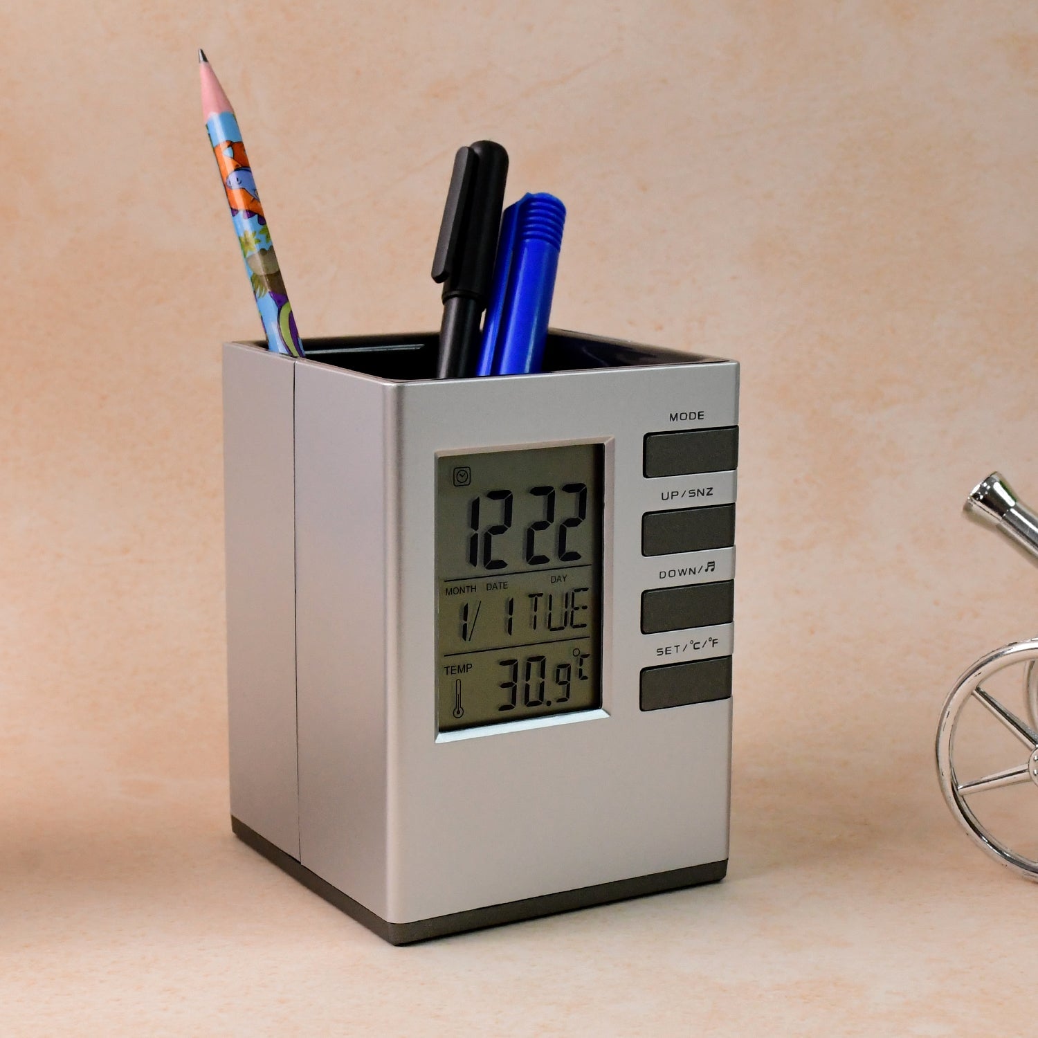 Multifunction digital desk clock showing time, date, and indoor temperature