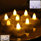Set of round LED flameless tealight candles glowing with warm flickering light