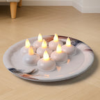 Battery operated round LED flameless tealight candles with warm white glow
